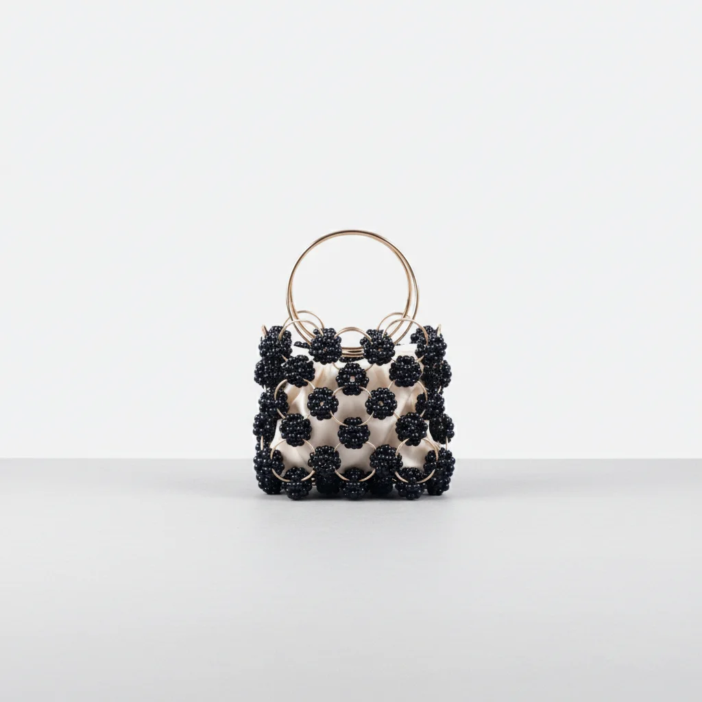 Sac soirée perles noires et anse dorée