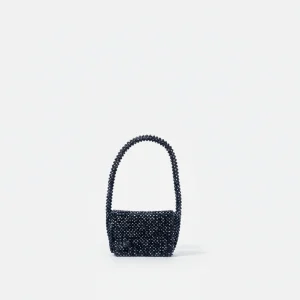 Sac soirée perles noires porté épaule